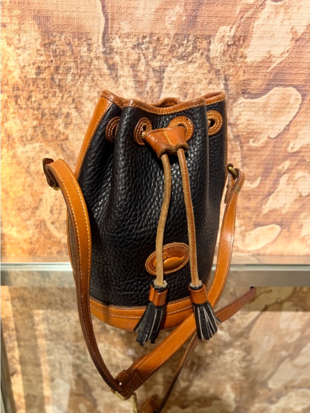 Dooney & Bourke Black Pebbled Leather Crossbody with Brown Logo Patch